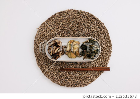 There are mushroom, pumpkin, and dried Siraegi leaf salad on the table mat There are mushroom, pumpkin, and dried Siraegi leaf salad on the table mat 112533678