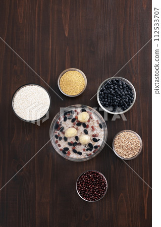 In a glass bowl, there are several mixed grains eaten during the New Year's Eve 112533707