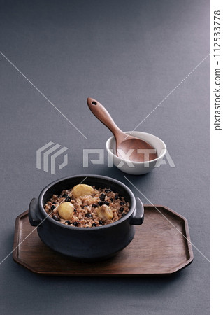 The dried vegetables are put on a plate on a wooden tray 112533778