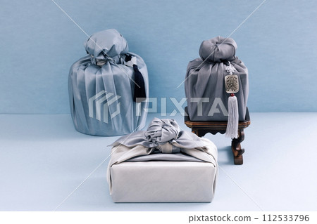 Several pieces of gift cloth are placed under the refreshments table Several pieces of gift cloth are placed under the refreshments table 112533796