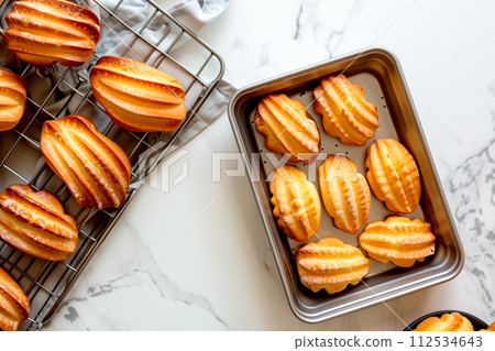 Classic French madeleine cookies, buttery and delicate, mini sponge cake baked in scallop mold 112534643