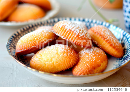 Classic French madeleine cookies, buttery and delicate, mini sponge cake baked in scallop mold 112534646