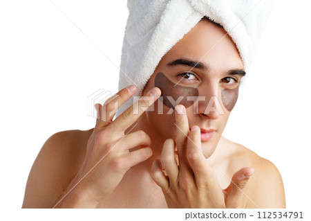 Portrait of attractive young male model with eye patches on white background Portrait of attractive young male model with eye patches on white background 112534791