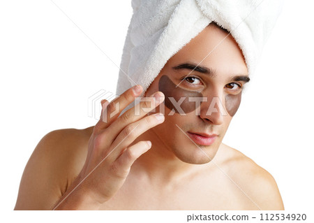 Portrait of attractive young male model with eye patches on white background Portrait of attractive young male model with eye patches on white background 112534920