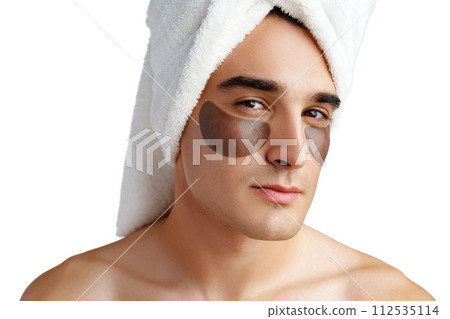 Portrait of attractive young male model with eye patches on white background Portrait of attractive young male model with eye patches on white background 112535114