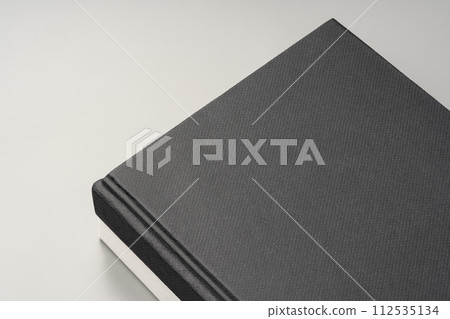 Blank notepad on gray background studio shot 112535134