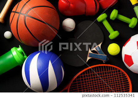 Various sports equipment on black background studio shot 112535341