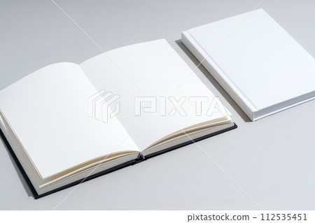 Blank open notepad on gray background studio shot 112535451