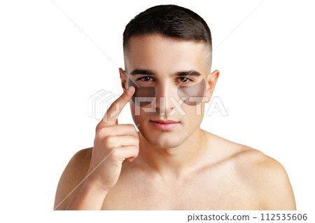 Portrait of attractive young male model with eye patches on white background Portrait of attractive young male model with eye patches on white background 112535606