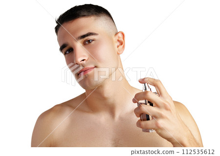 Handsome young man applying perfume on white background Handsome young man applying perfume on white background 112535612