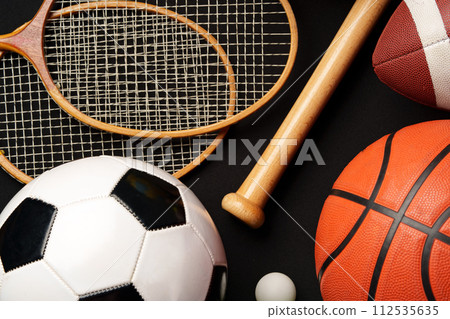 Various sports equipment on black background studio shot Various sports equipment on black background studio shot 112535635