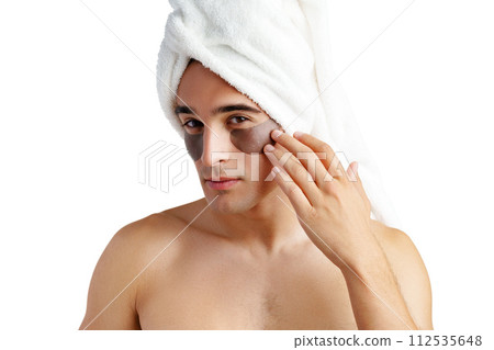 Portrait of attractive young male model with eye patches on white background Portrait of attractive young male model with eye patches on white background 112535648