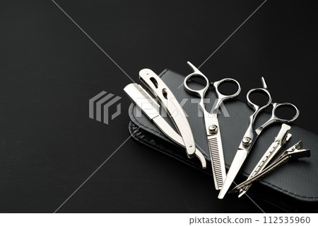 Tools for barbershop on black background studio shot Tools for barbershop on black background studio shot 112535960