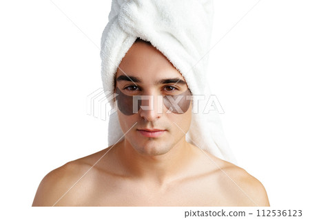 Portrait of attractive young male model with eye patches on white background Portrait of attractive young male model with eye patches on white background 112536123