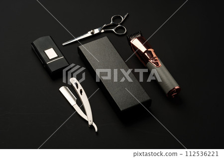 Tools for barbershop on black background studio shot Tools for barbershop on black background studio shot 112536221