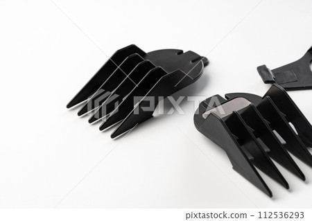 Nozzles for electric trimmer isolated on white background Nozzles for electric trimmer isolated on white background 112536293
