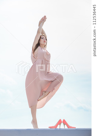 Woman in long dress elegant dress dancing Woman in long dress elegant dress dancing 112536445