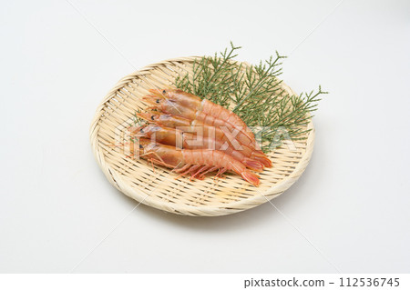 Raw red shrimp on a colander 112536745