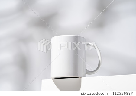 One white mug on gray background with shadow One white mug on gray background with shadow 112536887