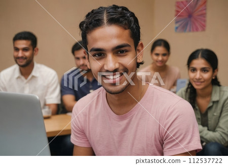 AI-generated content. Young group discussing over laptop smiling. Teamwork in a casual office environment. 112537722