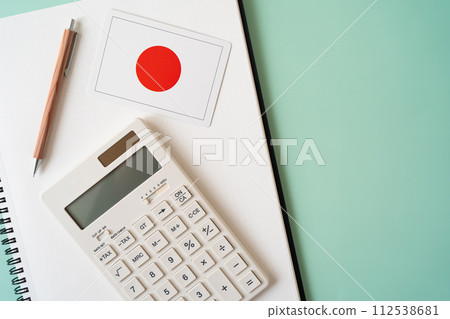 Japanese flag, calculator, notebook, pen Japanese flag, calculator, notebook, pen 112538681