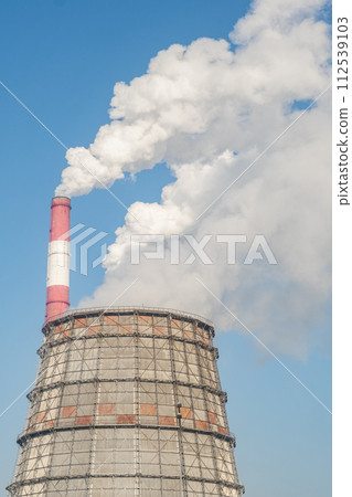 The work of a petrochemical plant. Smoke is coming from the chimney. The work of a petrochemical plant. Smoke is coming from the chimney. 112539103