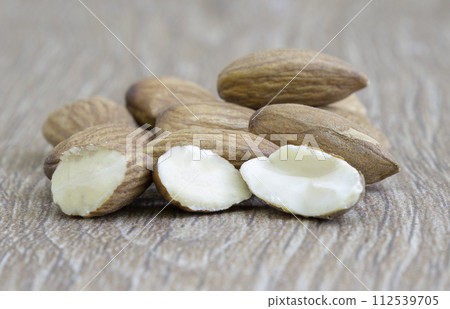 Almond nuts on wood background. Almond nuts on wood background. 112539705
