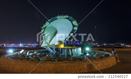 A fountain featuring an oyster with a gigantic pearl inside night timelapse hyperlapse with the Doha skyline behind it A fountain featuring an oyster with a gigantic pearl inside night timelapse hyperlapse with the Doha skyline behind it 112540527