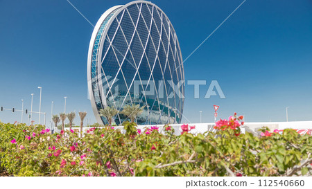 Circular skyscraper Aldar Headquarters Building timelapse in Abu Dhabi, UAE. Circular skyscraper Aldar Headquarters Building timelapse in Abu Dhabi, UAE. 112540660