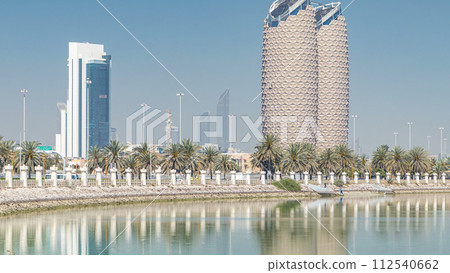 View of skyscrapers skyline with Al Bahr towers in Abu Dhabi timelapse. United Arab Emirates 112540662
