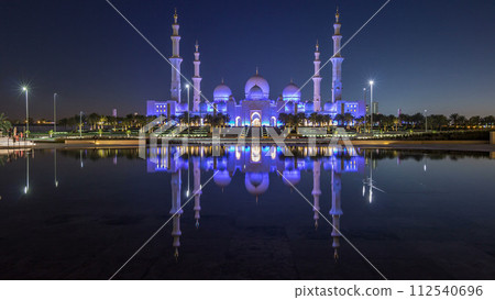 Sheikh Zayed Grand Mosque illuminated at night timelapse, Abu Dhabi, UAE. 112540696