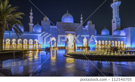 Sheikh Zayed Grand Mosque illuminated at night timelapse hyperlapse, Abu Dhabi, UAE. Sheikh Zayed Grand Mosque illuminated at night timelapse hyperlapse, Abu Dhabi, UAE. 112540705