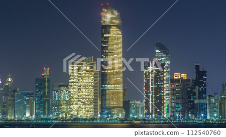 Panorama view of Abu Dhabi Skyline and seafront at night timelapse, United Arab Emirates 112540760