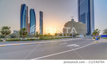 Skyscrapers of Abu Dhabi at sunset with Etihad Towers buildings timelapse. 112540764