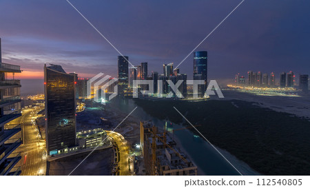 Buildings on Al Reem island in Abu Dhabi timelapse from above. Buildings on Al Reem island in Abu Dhabi timelapse from above. 112540805