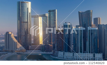 Buildings on Al Reem island in Abu Dhabi timelapse from above. Buildings on Al Reem island in Abu Dhabi timelapse from above. 112540820