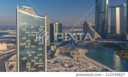 Buildings on Al Reem island in Abu Dhabi timelapse from above. 112540827