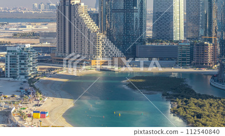 Buildings on Al Reem island in Abu Dhabi timelapse from above. 112540840