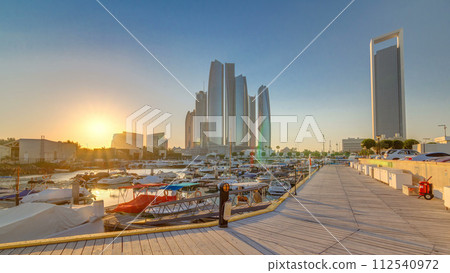 Al Bateen marina Abu Dhabi timelapse with modern skyscrapers on background 112540972