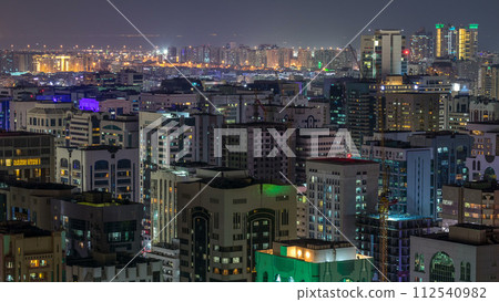 Aerial skyline of Abu Dhabi city centre from above night timelapse 112540982