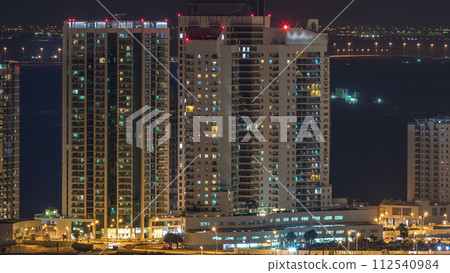 Aerial skyline of Abu Dhabi city centre from above night timelapse 112540984