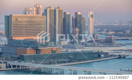 Aerial skyline of Abu Dhabi city centre from above day to night timelapse Aerial skyline of Abu Dhabi city centre from above day to night timelapse 112540987