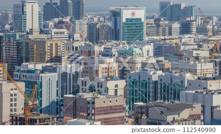 Aerial skyline of Abu Dhabi city centre from above timelapse Aerial skyline of Abu Dhabi city centre from above timelapse 112540990
