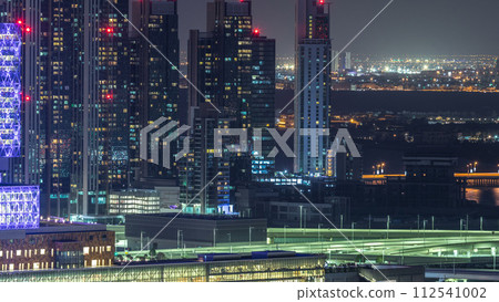 Aerial skyline of Abu Dhabi city centre from above night timelapse 112541002