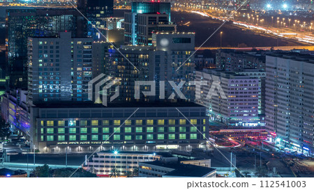 Aerial skyline of Abu Dhabi city centre from above night timelapse 112541003