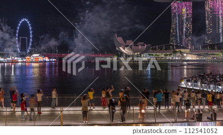 Fireworks display over the Marina Bay waterfront in celebration of the Lunar New Year timelapse 112541052
