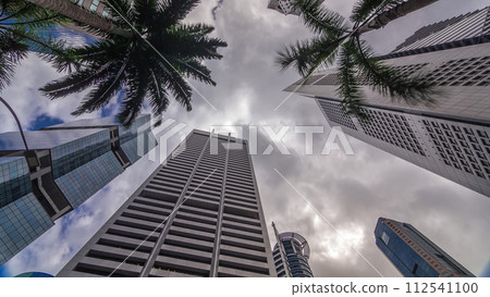 Looking up perspective of modern business skyscrapers glass and sky view landscape of commercial building in central city timelapse Looking up perspective of modern business skyscrapers glass and sky view landscape of commercial building in central city timelapse 112541100