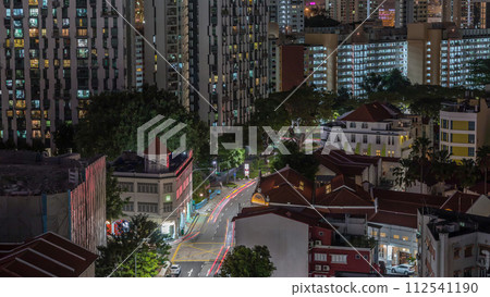 Aerial view of intersection and art deco shophouses along Neil road in Chinatown area night timelapse Aerial view of intersection and art deco shophouses along Neil road in Chinatown area night timelapse 112541190