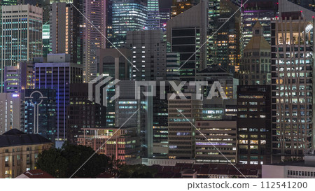 Aerial cityscape of Singapore downtown of modern architecture with skyscrapers night timelapse Aerial cityscape of Singapore downtown of modern architecture with skyscrapers night timelapse 112541200