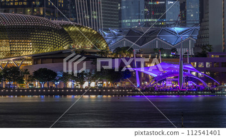 The Esplanade Theatres on the Bay in Singapore at dusk, with beautiful reflection in water night timelapse 112541401